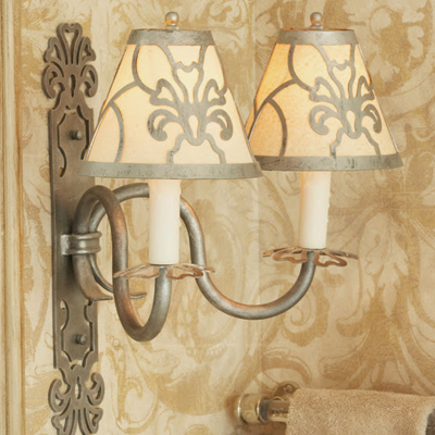 Two bathroom lamps with a beautiful design on them